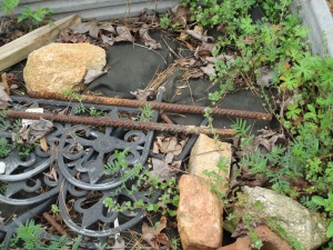 Rocks, rebar, and borders used in the garden.